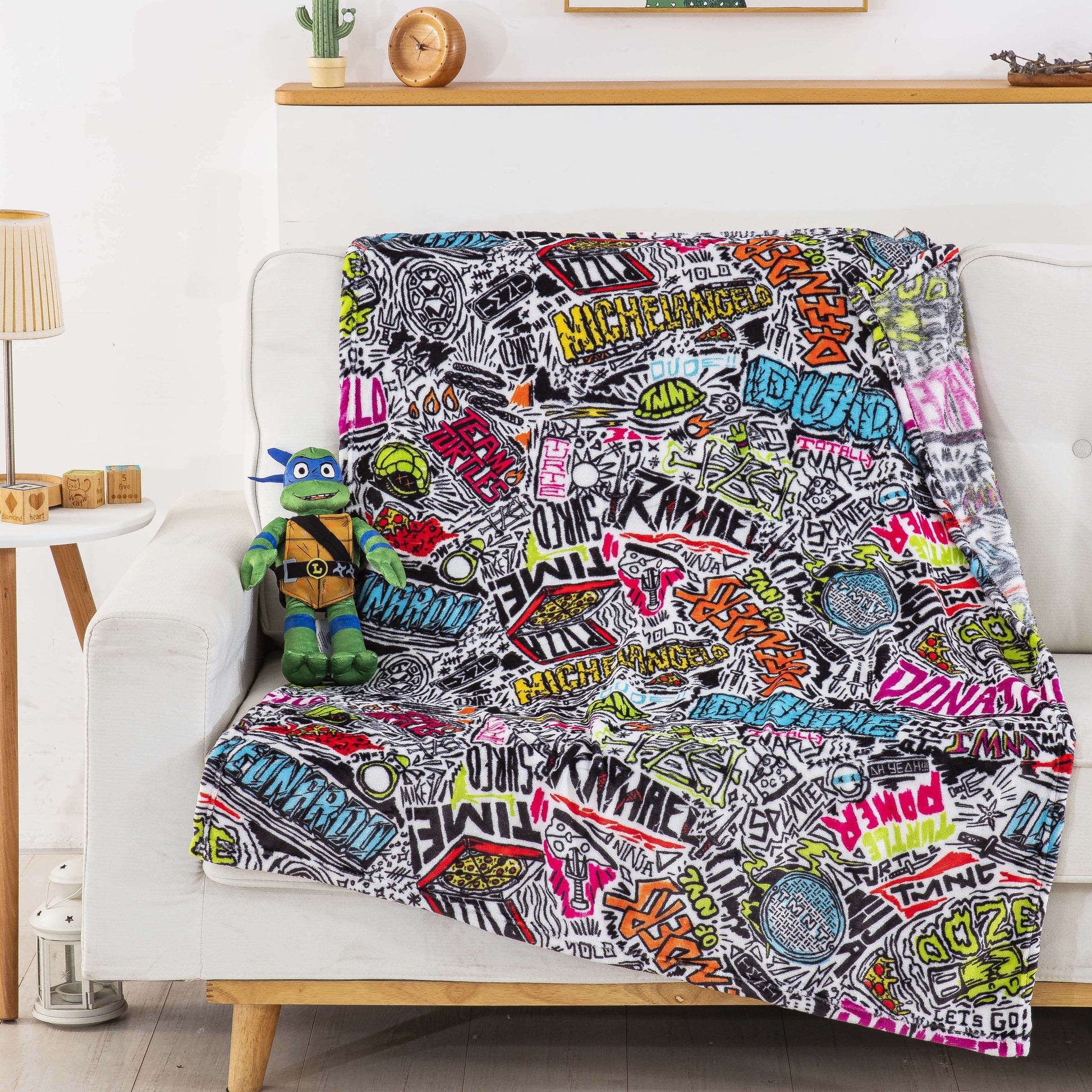Decorative Knitted Teenage Mutant Tutles Sketched Out Kids Silk Touch Throw Blanket with Plush Hugger – Ultra Soft Plush Character Pillo... - Cozy Fleece Throw Blanket for Couch & Bed Detail